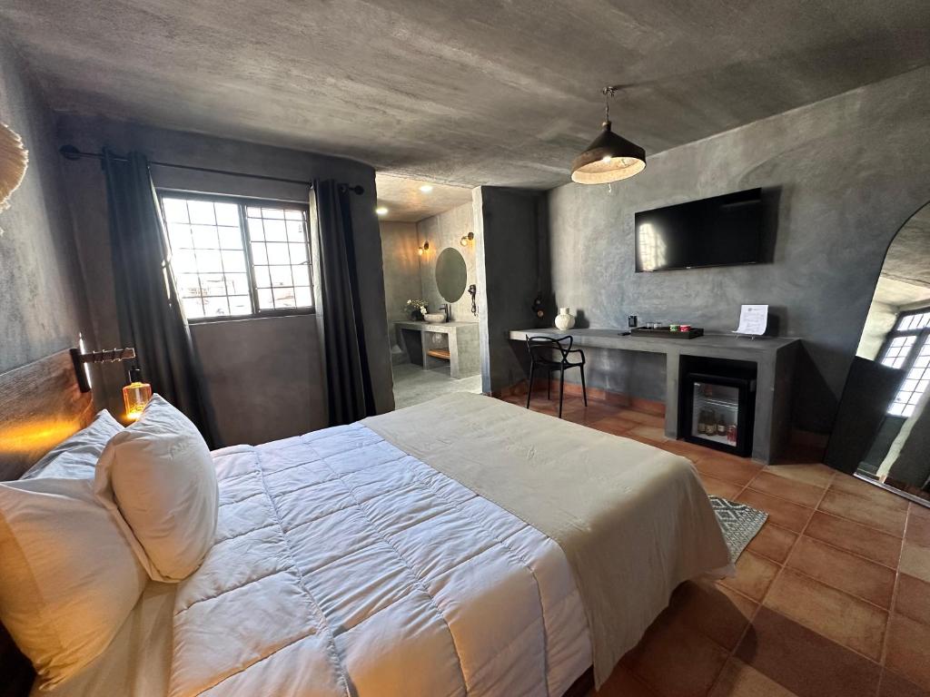 Postel nebo postele na pokoji v ubytování Hotel Damiana Boutique
