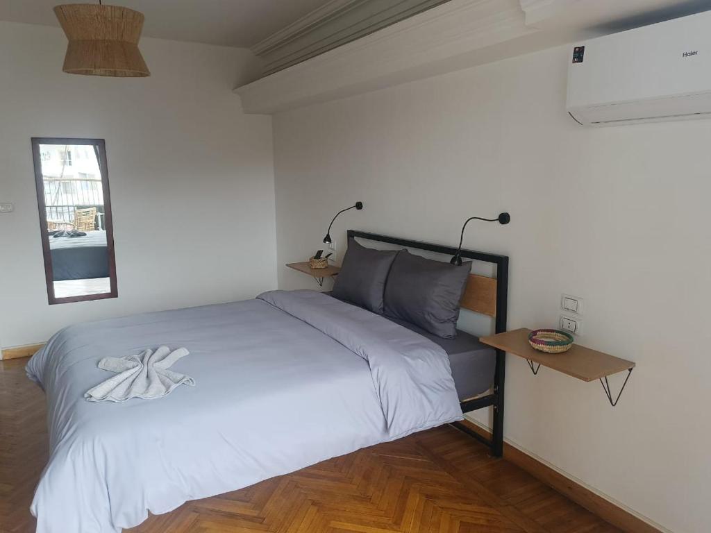Postel nebo postele na pokoji v ubytování Pyramids Nights Hostel