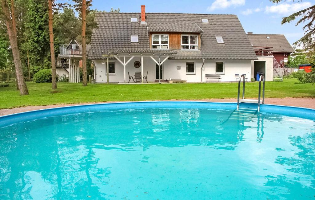 a large swimming pool in front of a house at Ferienwohnung Pruchten in Pruchten