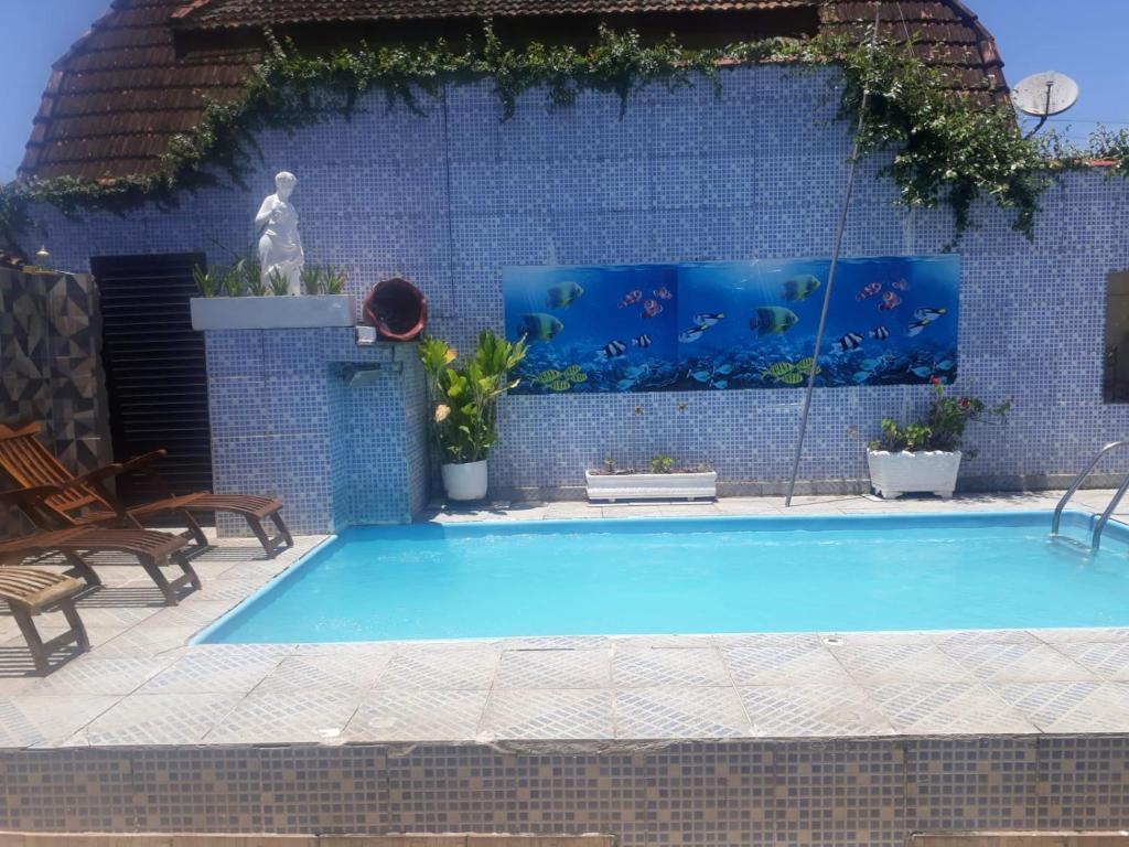 Πισίνα στο ή κοντά στο Casa aconchegante próximo praia