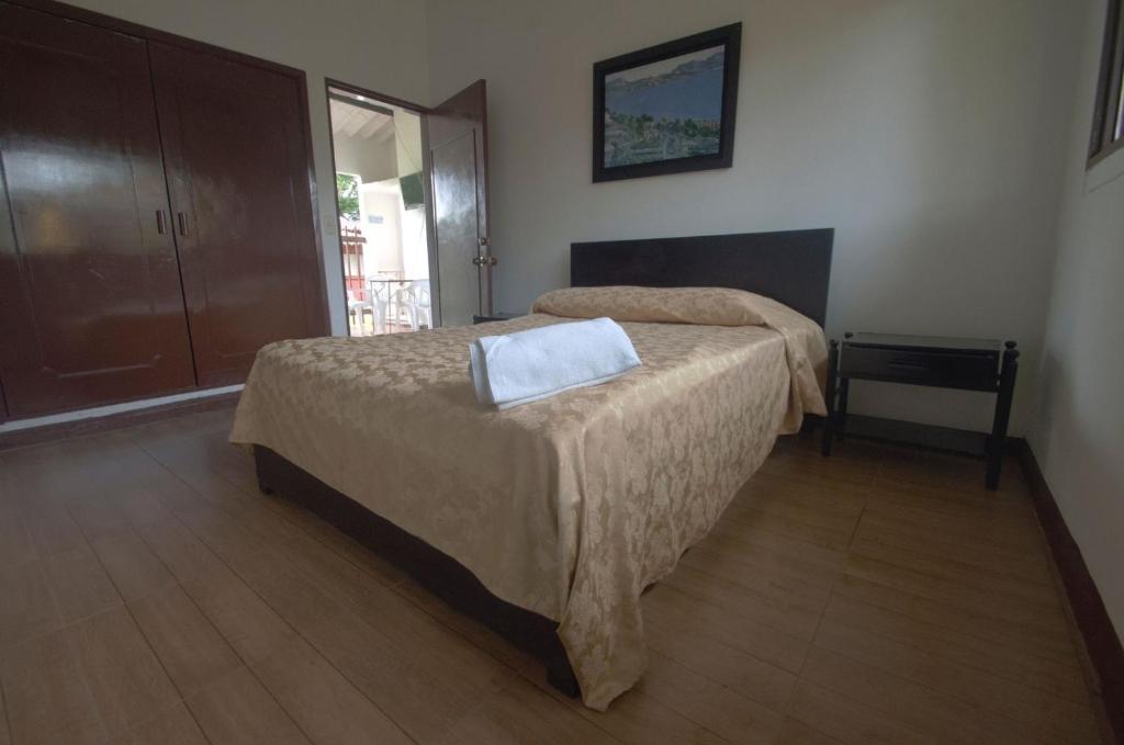 Postel nebo postele na pokoji v ubytování Tacuara Hotel
