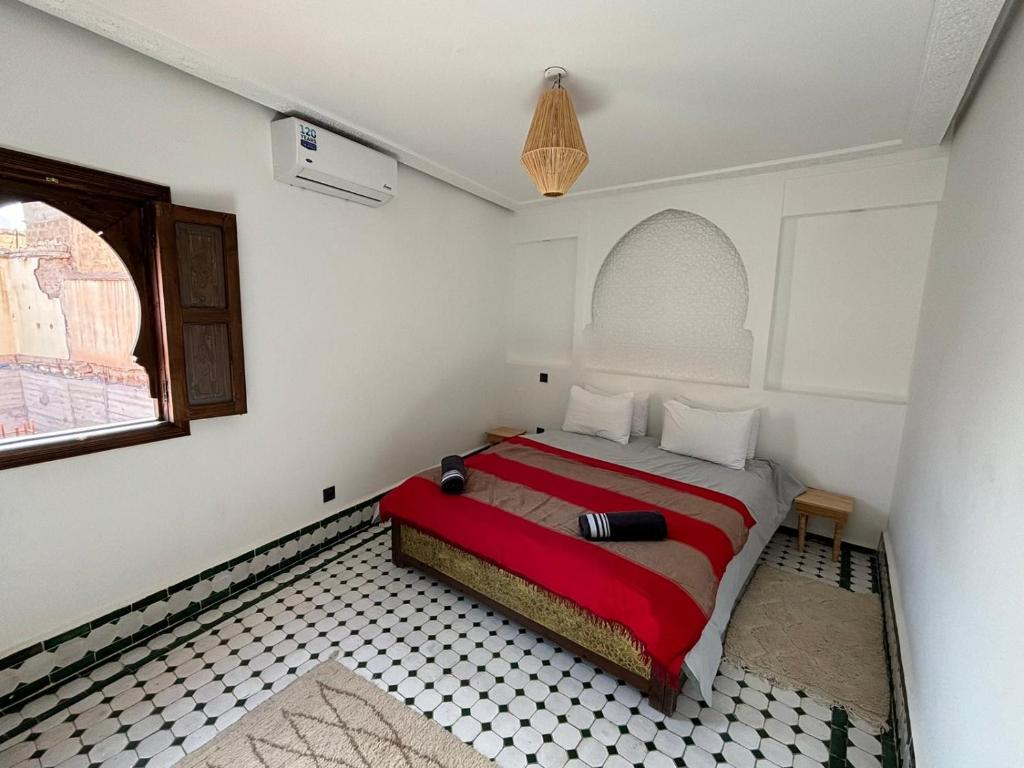 Postel nebo postele na pokoji v ubytování RIAD KS & SPA