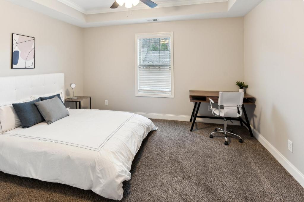 a bedroom with a bed and a desk and a computer at Biltmore Luxury 1513 #8 Townhomes L 2bd 2 Bth in Clarksville