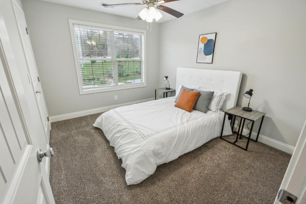 a white bedroom with a bed and a window at Biltmore Luxury 1517 #2 Townhomes L 2bd 2 Bth in Clarksville