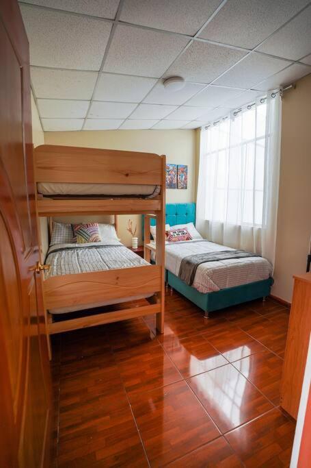 Postel nebo postele na pokoji v ubytování Sweet Home tu hogar en Cusco