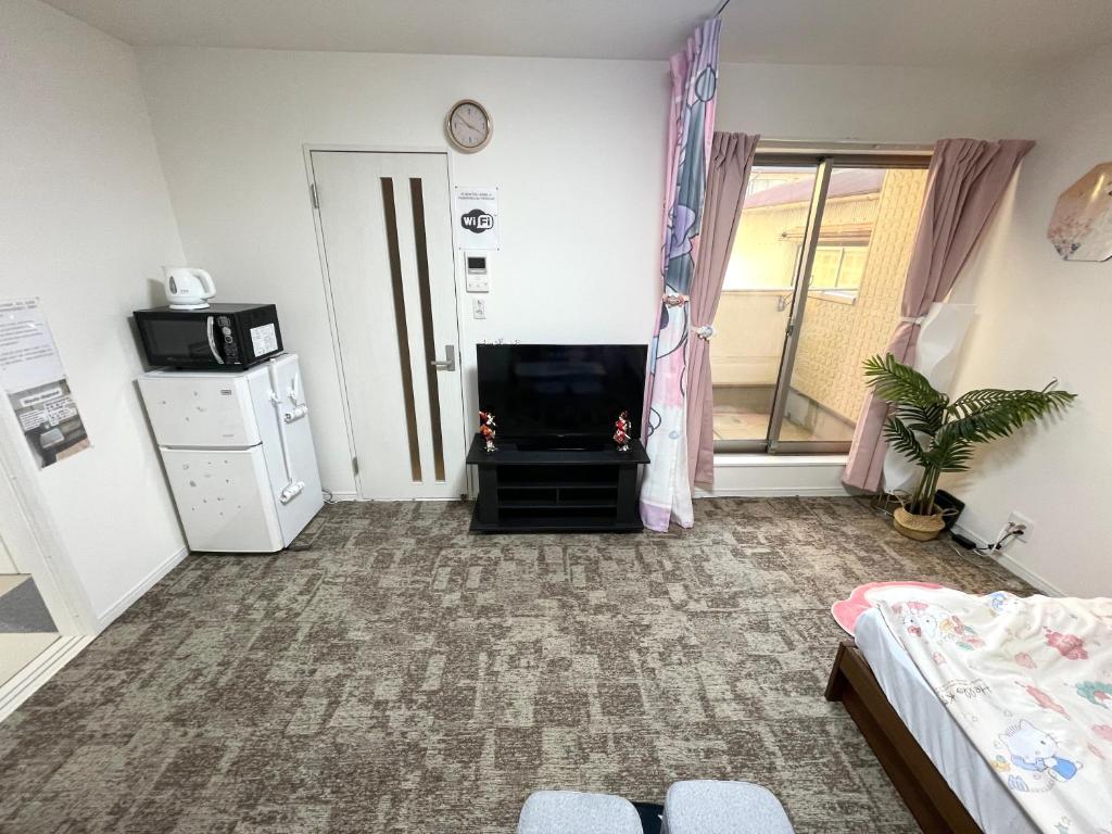 Kitchen o kitchenette sa 糖果屋 岸里玉出