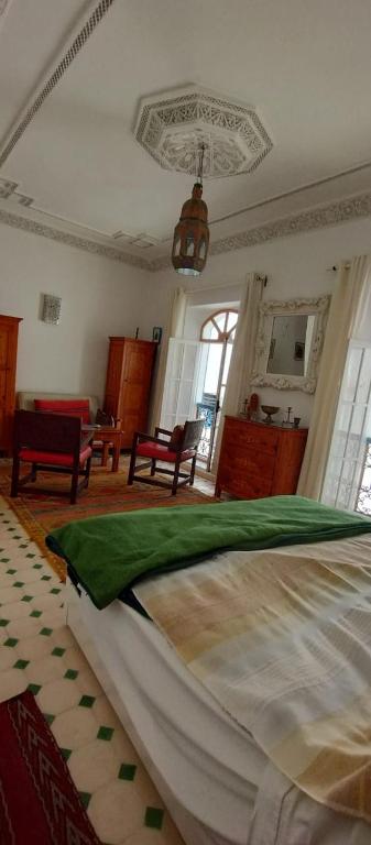 Postel nebo postele na pokoji v ubytování Riad L'ostale