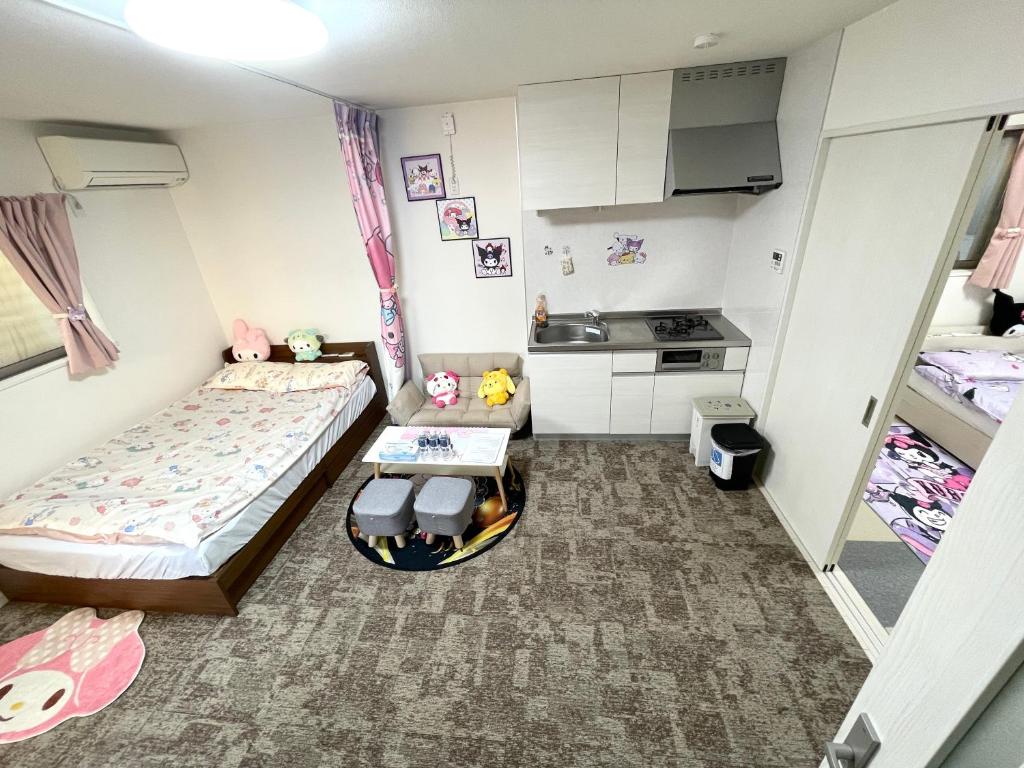 Kama o mga kama sa kuwarto sa 糖果屋 岸里玉出
