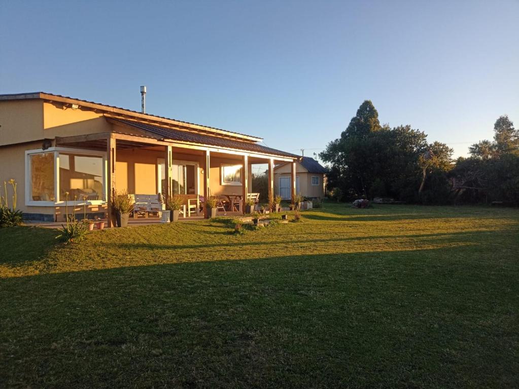 a house with a large lawn in front of it at Casa en Chapa in La Estafeta