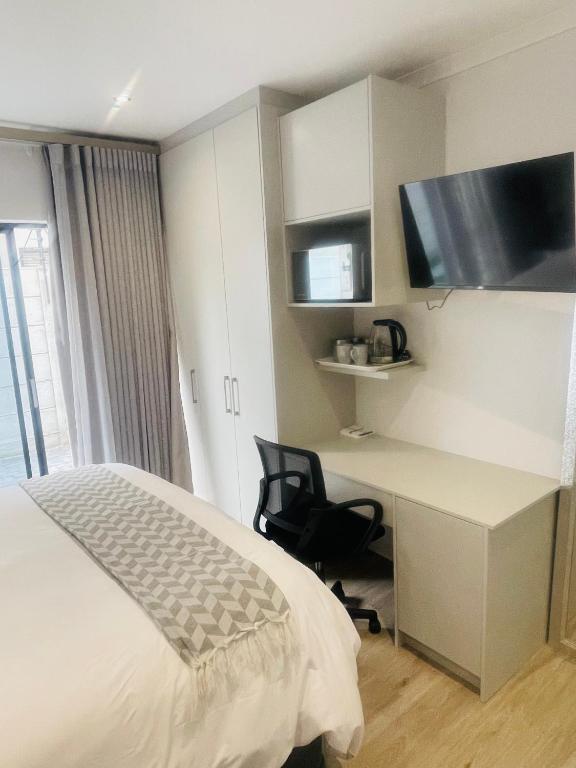 Μια τηλεόραση ή/και κέντρο ψυχαγωγίας στο Private Luxury Room by 29 Holborn