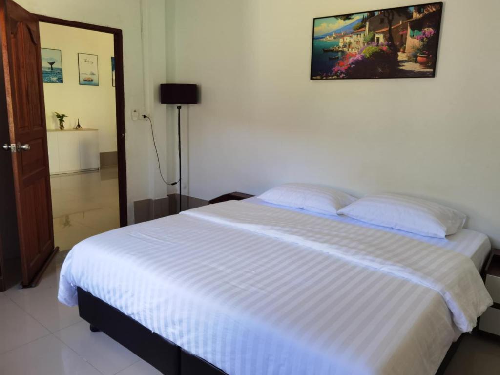 Un ou plusieurs lits dans un hébergement de l'établissement The Secret Garden Homestay Koh Yao Yai