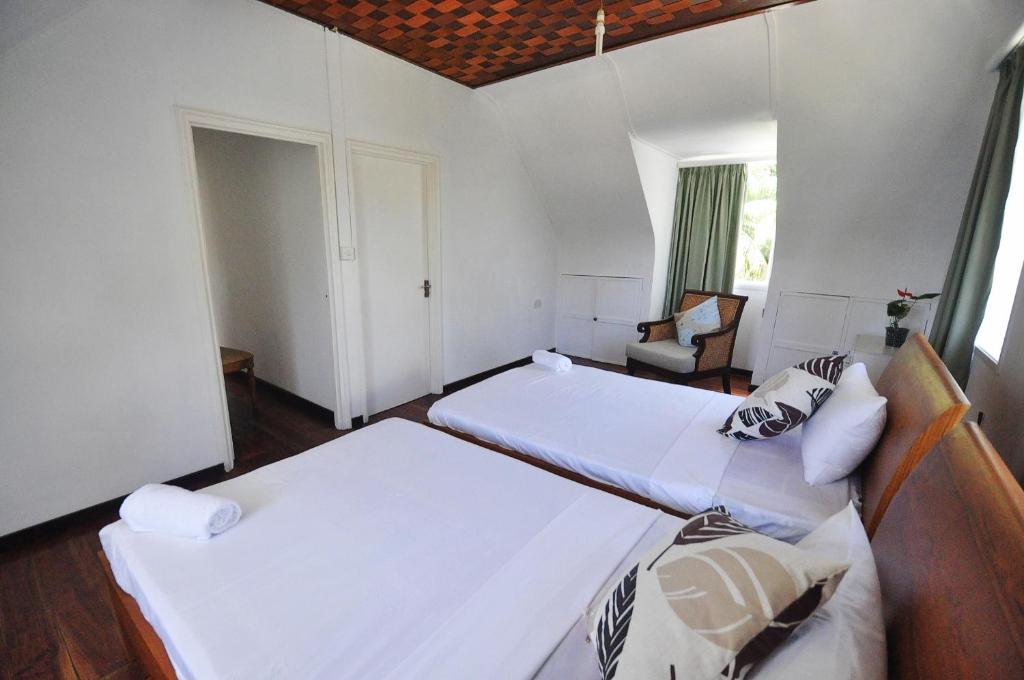 Postel nebo postele na pokoji v ubytování Petit Baie Chalets