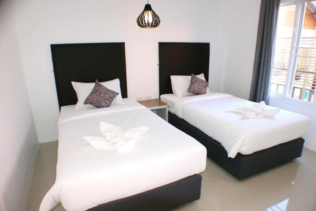 Postel nebo postele na pokoji v ubytování Non Du Lay Guesthouse