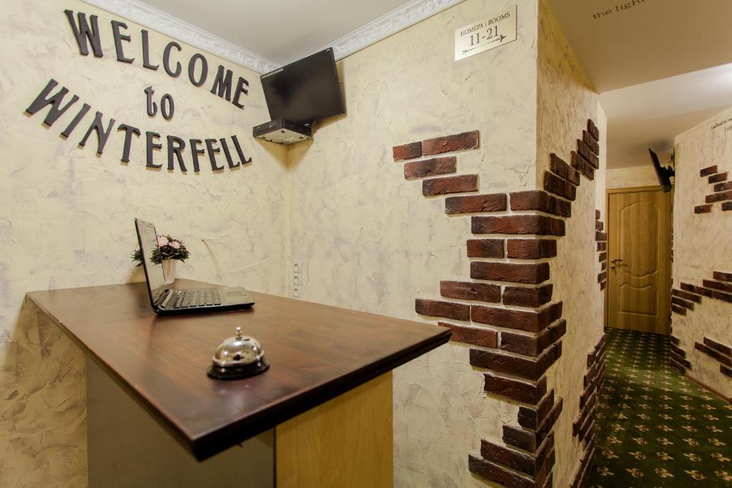 a hallway with a brick wall with a welcome to minnesota sign at WinterFell On Arbat Hotel in Moscow