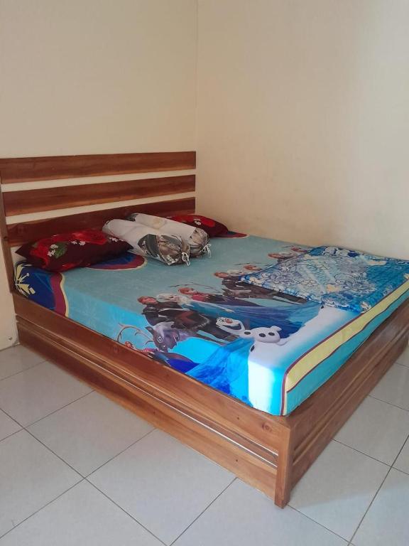 Postel nebo postele na pokoji v ubytování Villa Berkah Izzul Sawarna