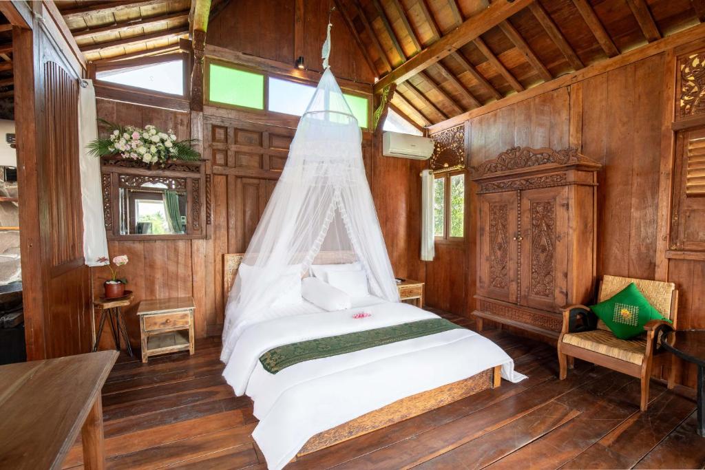 Postel nebo postele na pokoji v ubytování JavaLO Villa Lombok