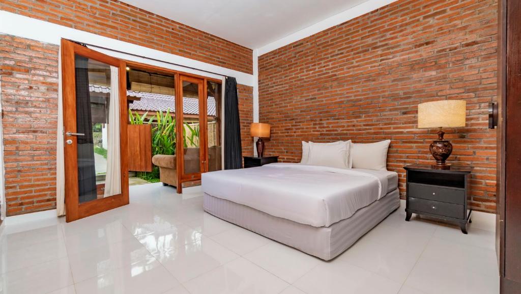 Postel nebo postele na pokoji v ubytování As I Am Ubud Retreat