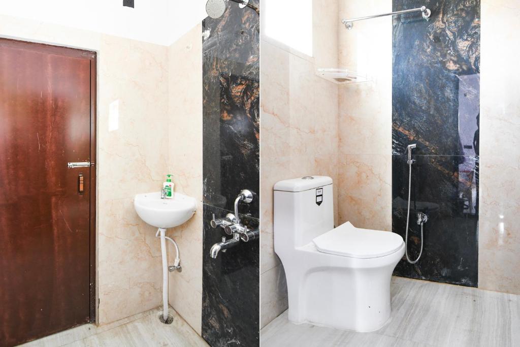 Koupelna v ubytování Super Hotel O MNJ Mansion