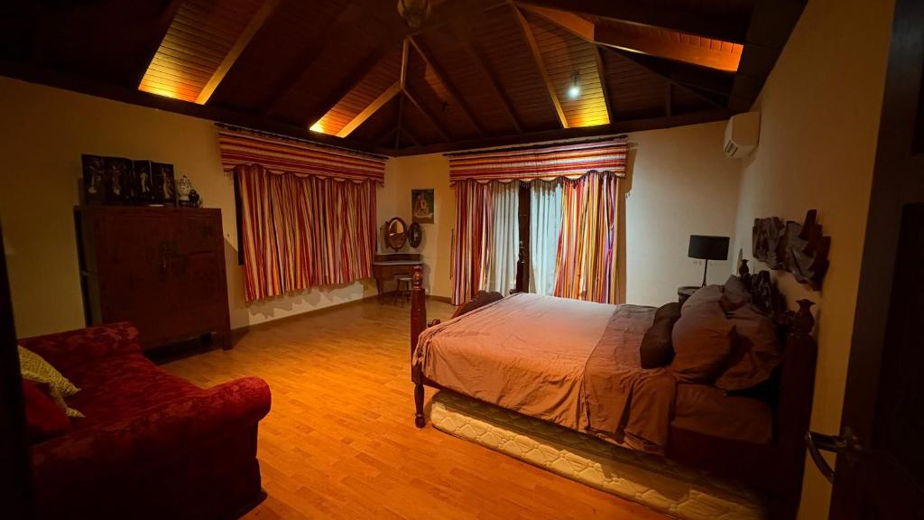 Voodi või voodid majutusasutuse Laman Padi Villa in langkawi toas