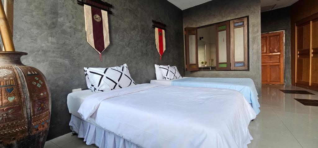Postel nebo postele na pokoji v ubytování Velanon Phuket