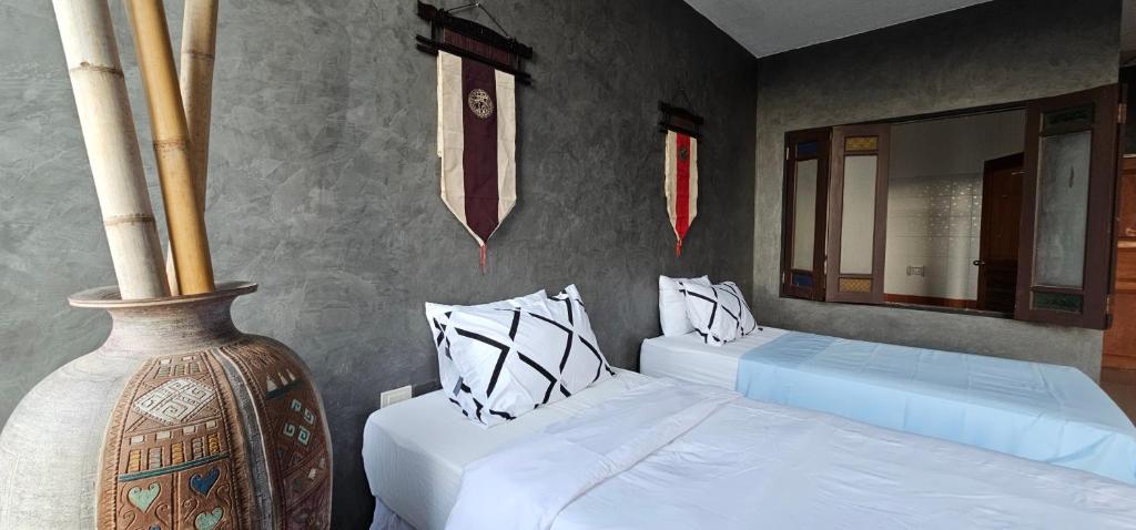 Postel nebo postele na pokoji v ubytování Velanon Phuket