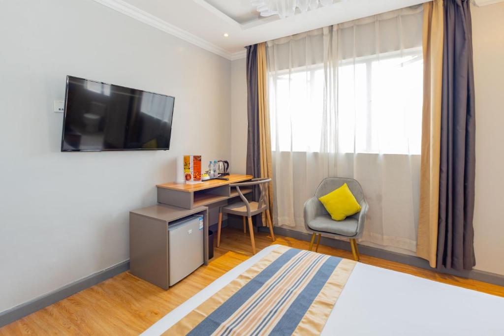 TV a/nebo společenská místnost v ubytování Raha Suites - Westlands