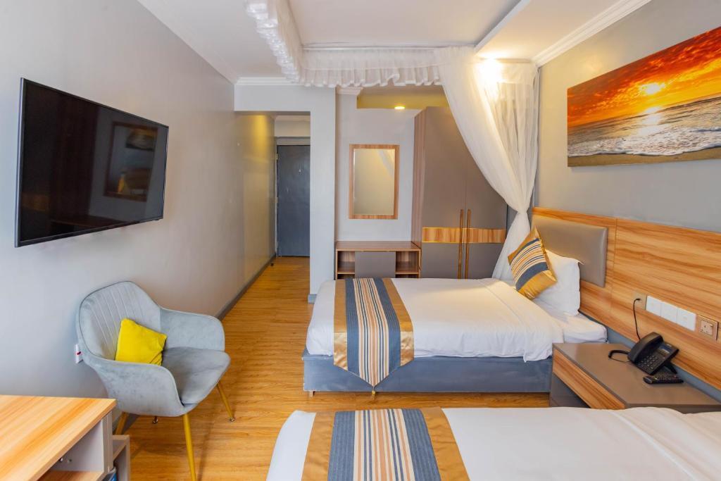 TV a/nebo společenská místnost v ubytování Raha Suites - Westlands