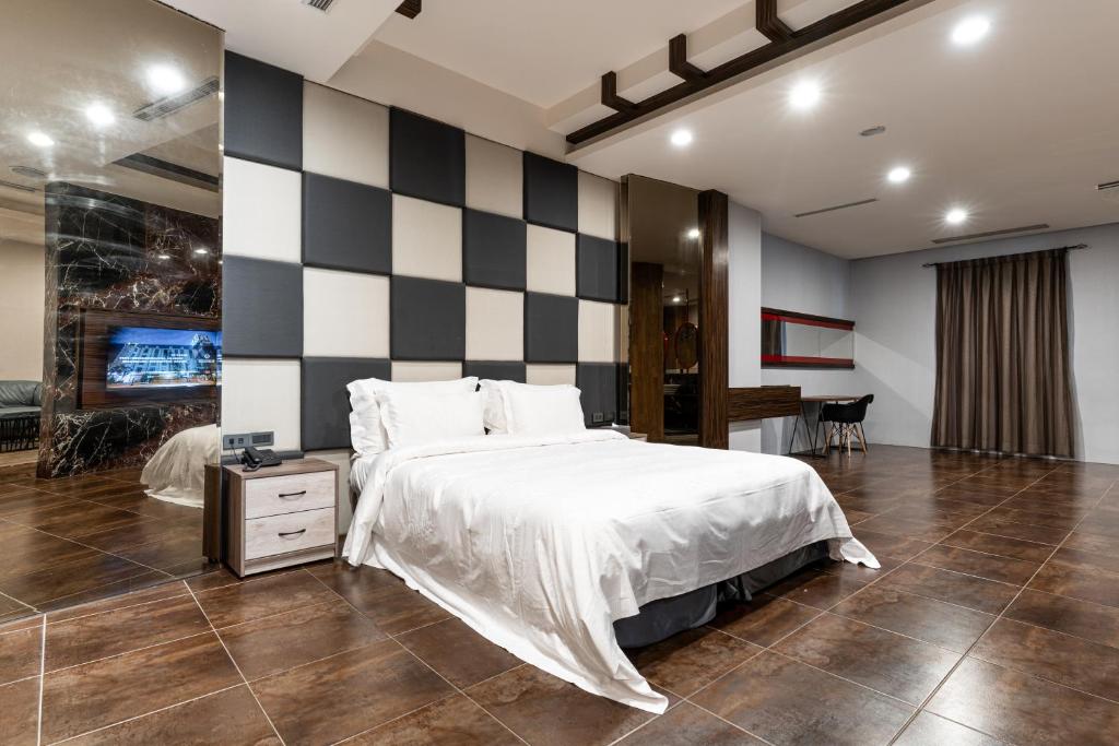 Postel nebo postele na pokoji v ubytování OHYA Chain Boutique Motel-Yongkang