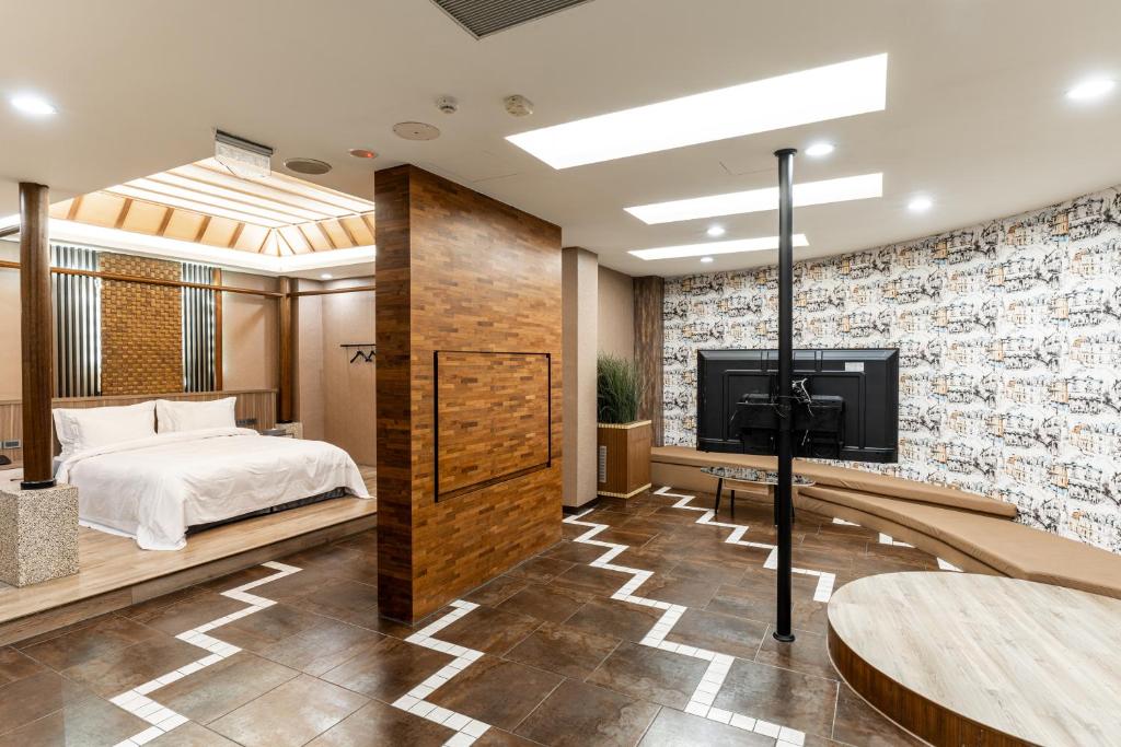 Postel nebo postele na pokoji v ubytování OHYA Chain Boutique Motel-Yongkang