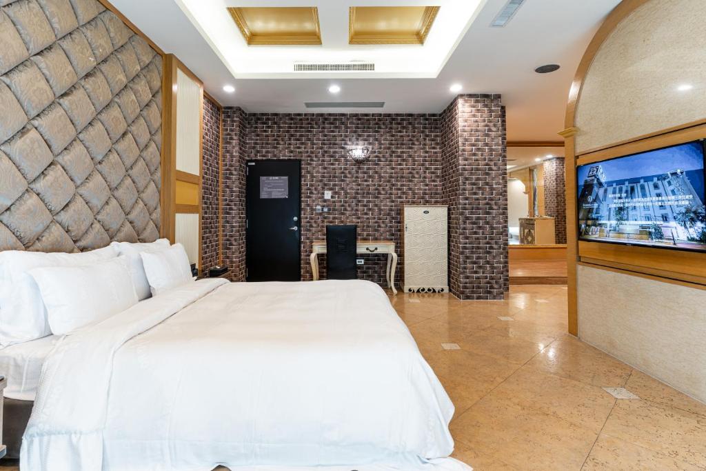 Postel nebo postele na pokoji v ubytování OHYA Chain Boutique Motel-Yongkang