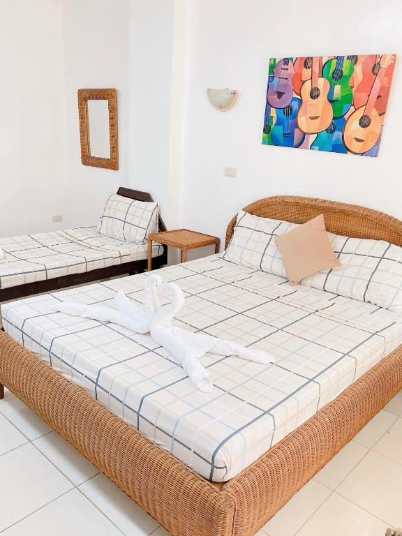 Katil atau katil-katil dalam bilik di Happy Home Hotel Beachfront