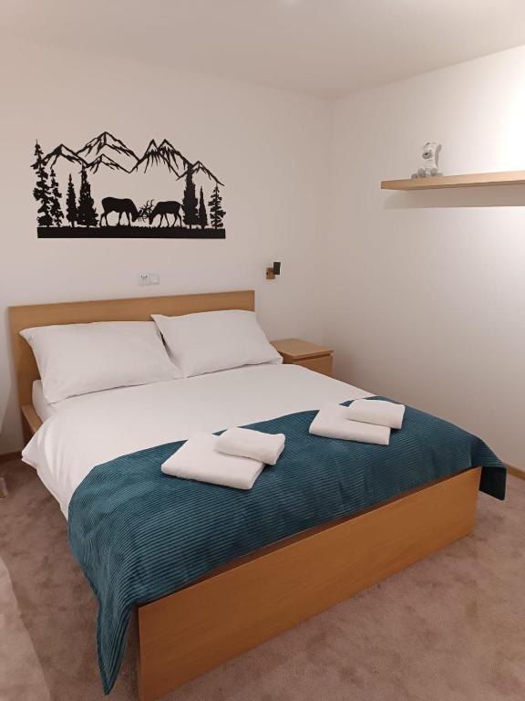 Postel nebo postele na pokoji v ubytování Apartmány pod Mníchom