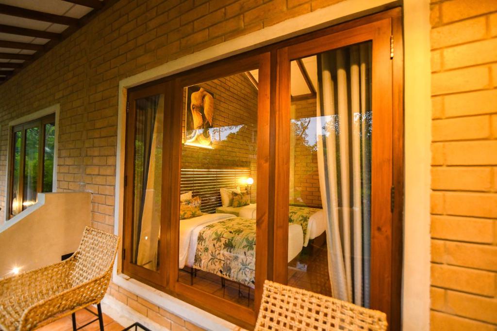 Postel nebo postele na pokoji v ubytování Dhalaya Resort Udawalawe