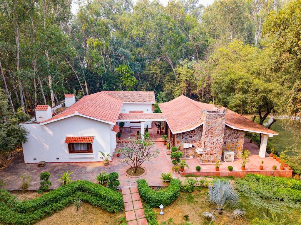 an aerial view of a house at amã Stays & Trails Lotus Dhauj , Haryana in Faridabad