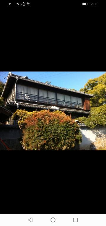 a building with windows on the side of it at i Authentic Trad Villa in Onomichi
