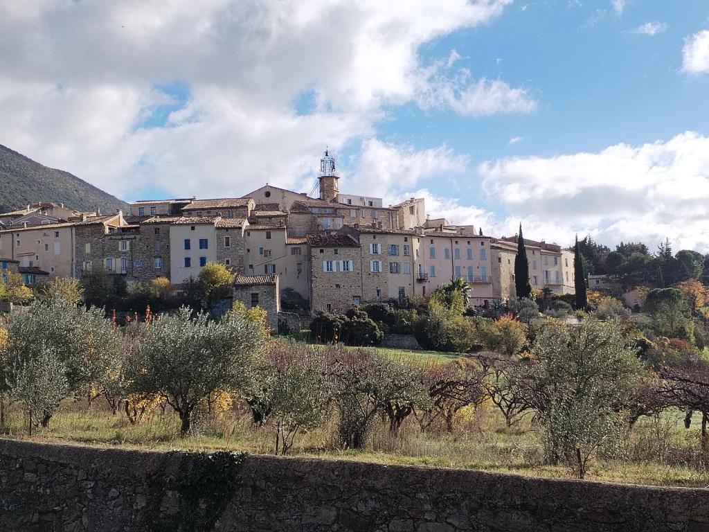a large building on top of a hill with trees at Mes Maisons - Holiday Villa in Drome Provencale - Villa Bellevue Venterol 26110 in Venterol