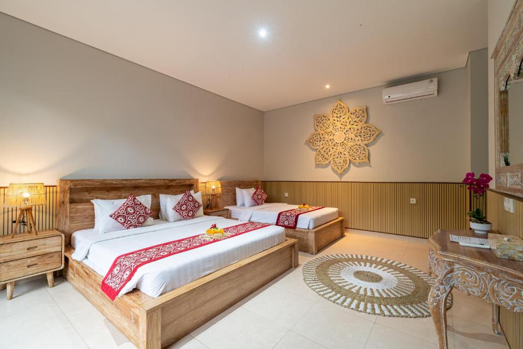 Postel nebo postele na pokoji v ubytování Narada Suite & Villa
