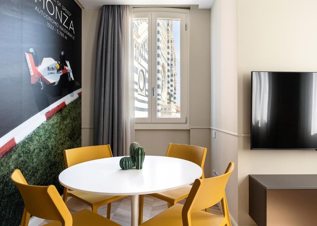 Telewizja i/lub zestaw kina domowego w obiekcie Casa Duomo Luxury Suites