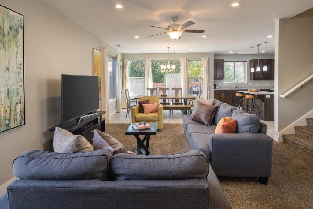 a living room with two couches and a dining room at Entrada at Moab 442 in Moab
