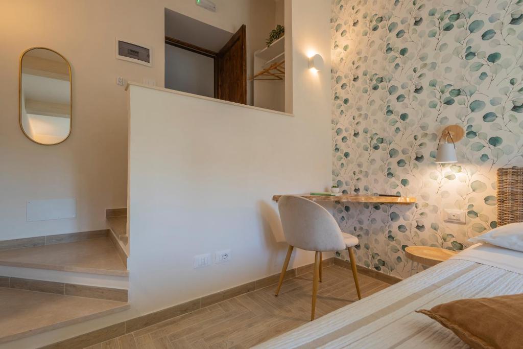 Łóżko lub łóżka w pokoju w obiekcie B&B La Rocca