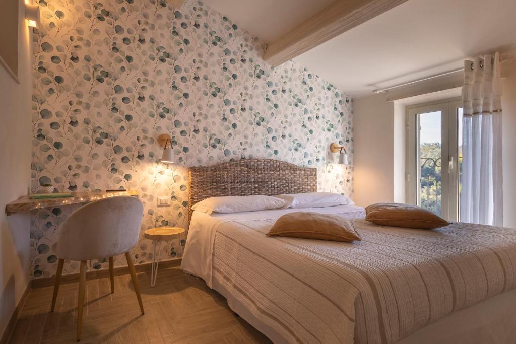 Łóżko lub łóżka w pokoju w obiekcie B&B La Rocca