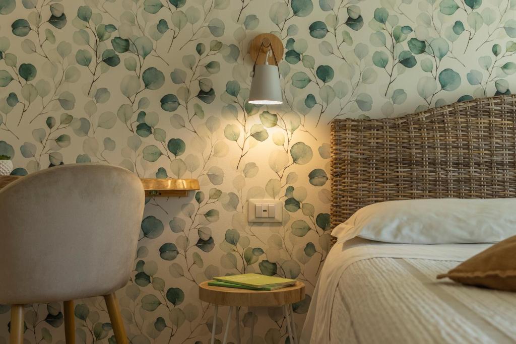 Łóżko lub łóżka w pokoju w obiekcie B&B La Rocca