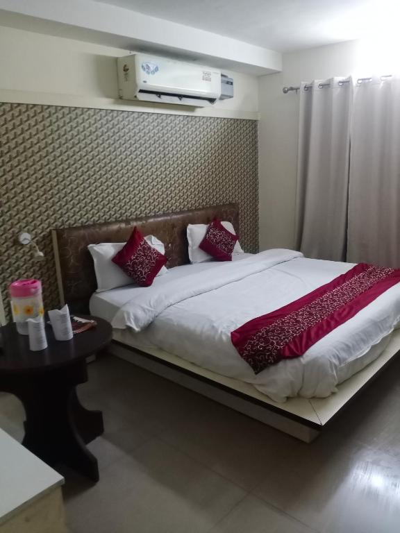 Postel nebo postele na pokoji v ubytování Hotel Vikrant