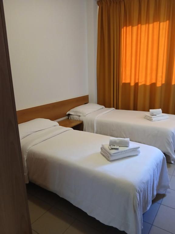 Postel nebo postele na pokoji v ubytování Hotel Ponsacco HP
