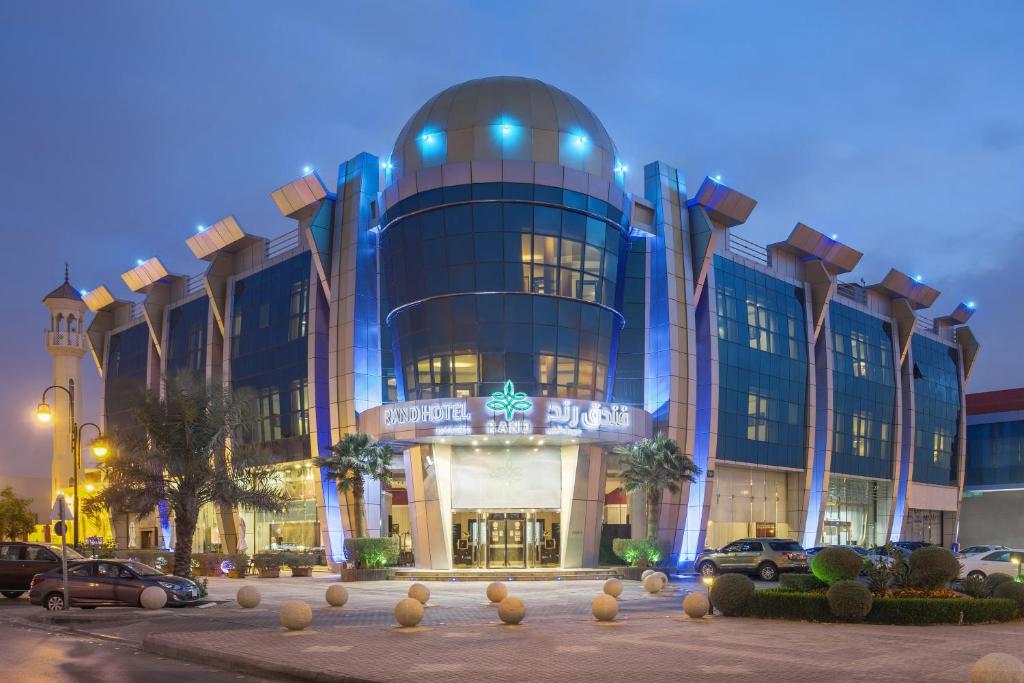 a large building with cars parked in front of it at RAND by Wandalus in Riyadh