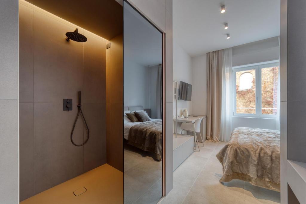 Postel nebo postele na pokoji v ubytování Santa Lucia Suites