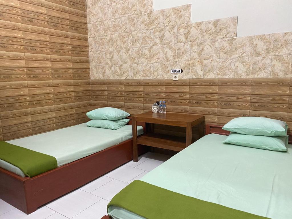 Postel nebo postele na pokoji v ubytování ADA Homestay