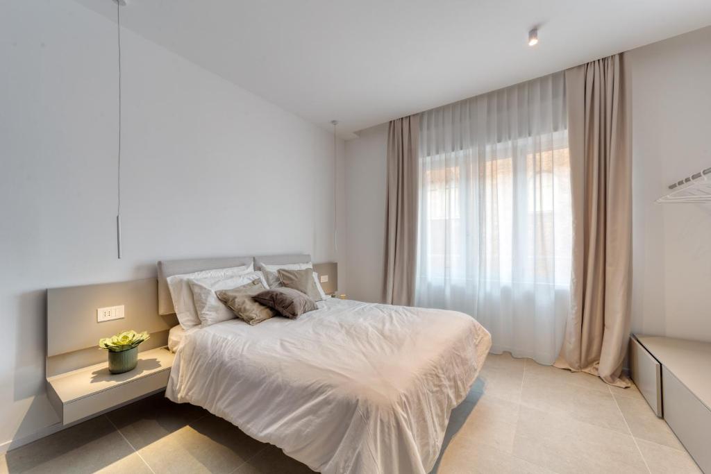 Postel nebo postele na pokoji v ubytování Santa Lucia Suites