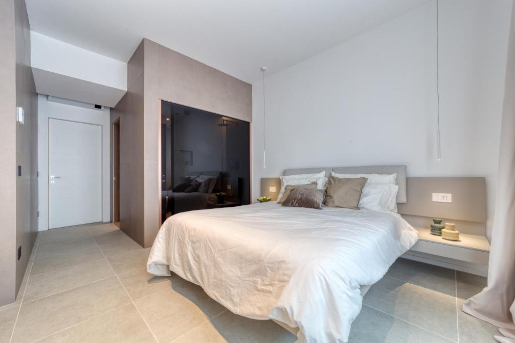 Postel nebo postele na pokoji v ubytování Santa Lucia Suites