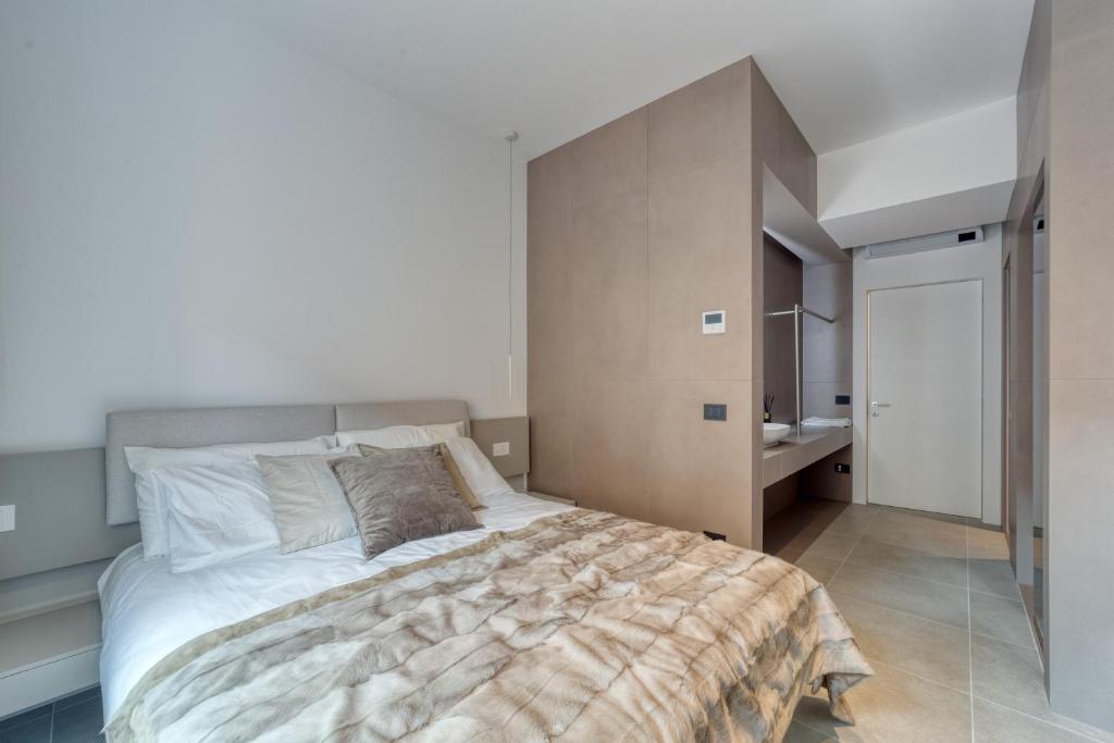 Postel nebo postele na pokoji v ubytování Santa Lucia Suites